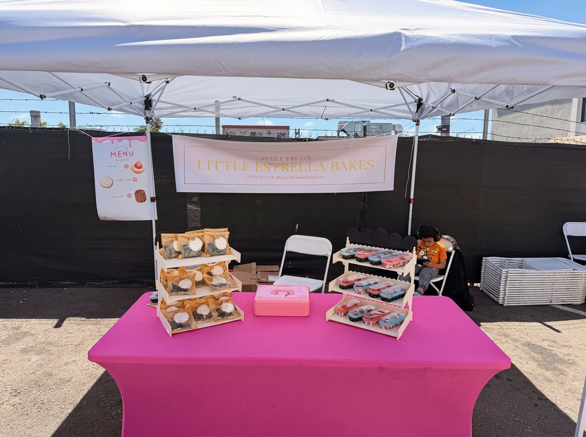 The Little Estrella Bakes market booth set up with treats
