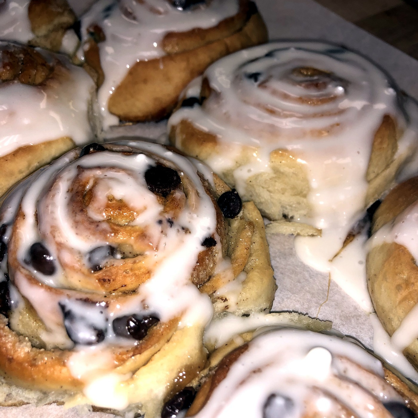 A pan of sourdough cinnamon rolls with glaze